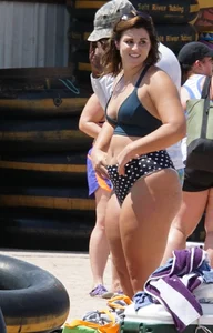 Girls in bikinis getting ready for tubing