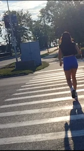 Sexy Candid Girl in a Top And Blue Shorts Walking Down the Street Creepshots Gallery