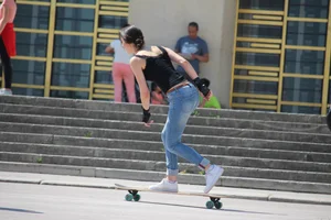 Hot brunette skateboarder in tight jeans and with hard nipples