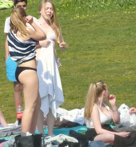 Teen taking off her dress in the park