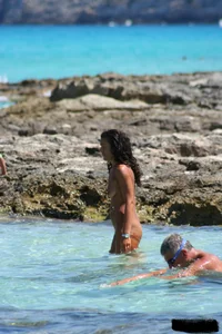 Nude beach ladies in the water showing their tits