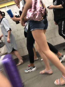 Tall Candid Teen Girl in Denim Shorts And Sandals Sitting in the Subway Train, Then Walking Down the Station