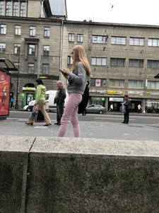 Cute skinny blonde candid teen wearing tight pink jeans