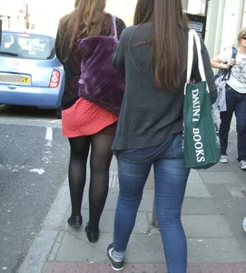 Girl in a pink skirt and stockings accidentally showing some cheek