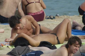 Topless girls on a beach in Barcelona