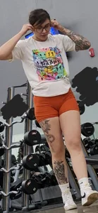 Tattooed PAWG showing cakes in tight shorts