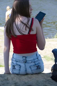 Pretty candid girls with nice legs sitting in denim shorts