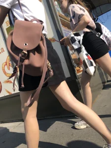 Couple of Skinny Girls in Mini-Skirts And Sneakers Street Photos
