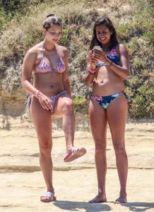 Group of sexy friends at the beach in bikinis