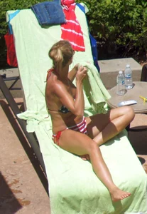Blonde babe at the pool with sexy body in USA bikini