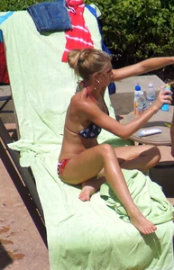 Blonde babe at the pool with sexy body in USA bikini