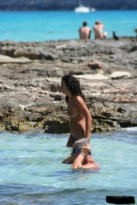 Nude beach ladies in the water showing their tits