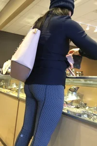 Brunette jewelry shopping in leggings with a nice ass