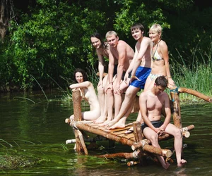 Only one is nude - group photos where only 1 girl is naked, and the rest of the people are dressed