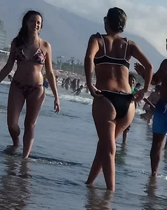 Milf with a big booty in a bikini at the beach