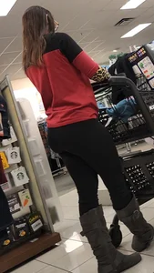 Brunette with a tight butt, boots, and a VPL