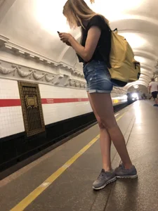 Cute Skinny Teen in Jean Mini Shorts Standing on the Subway Platform