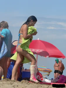 Couple of thick beach teens in little thong bikinis