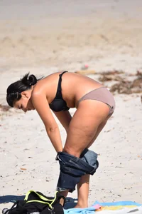 Thick mature brunette bikini lady on the beach with a nice body