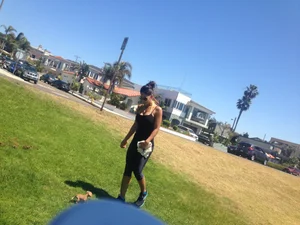 Hot brunette babe in leggings walking her dog with a nice ass and some cleavage
