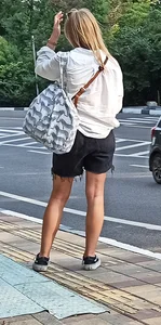 Blond Candid Girl in Shorts With Slim Legs Street Photo
