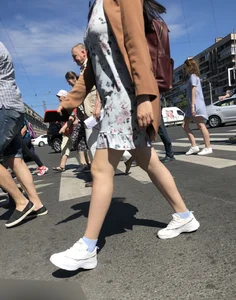 Nice legs of a candid girl crossing the street