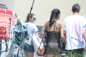 Sexy Florida girl showing her white thong bikini under see through dress