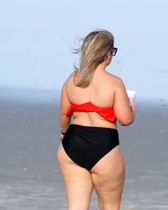 Thick BBW blonde lady in a bikini at the beach