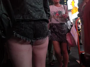 Girl in NYC showing her ass cheeks in denim shorts