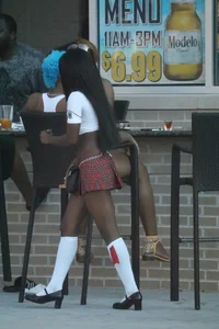 Sexy ebony Tilted Kilt employee in her uniform