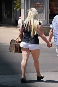 Thick blonde with big boobs in short white shorts