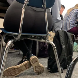 Booty in yoga pants, candid college teen sitting at her desk in class