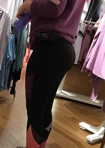 Pink employee with a perfectly round ass in leggings