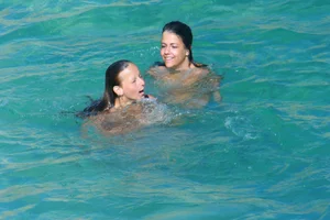 FKK Nudists playing in the water with floater