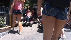 2 teens at Disney Land with short jean shorts