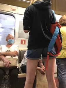 Girl in Shorts Standing in a Subway Train With Spread Legs - Creepshots Gallery