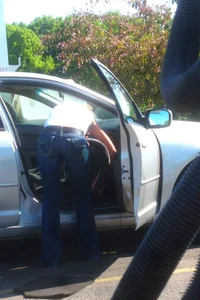 Girls cleaning their cars in jeans and pants