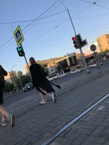 Teen wearing black dress which becomes transparent