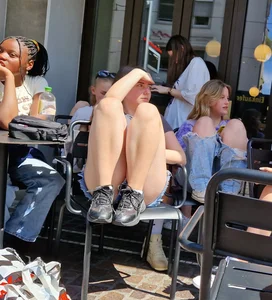 A Nice Candid Girl in a Top And Denim Shorts Hanging Out With Her Friends in a Street Cafe, Great Legs