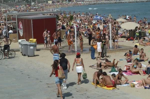 Topless girls on a beach in Barcelona