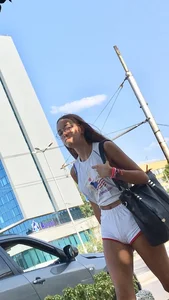 Cute candid girl with glasses in white shorts showing cheeks