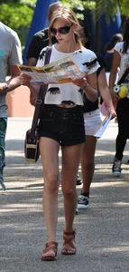 Skinny blonde chick in little denim shorts