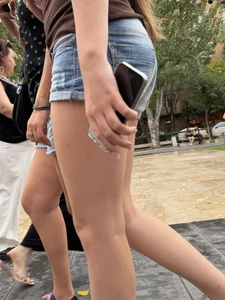 Candid teen wearing denim shorts passing by, nice legs