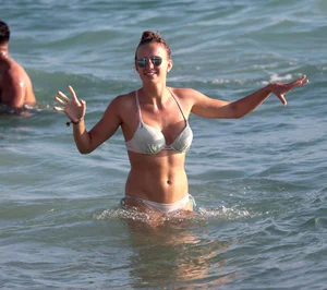 Sexy beach girl in bikini with her other sexy friend