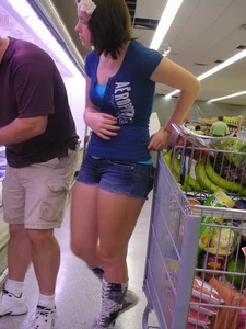 Pretty girl grocery shopping in short shorts
