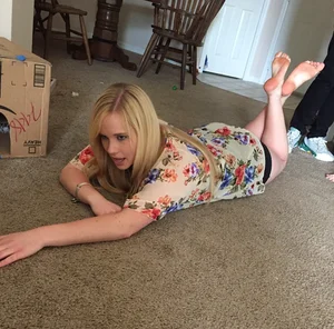 Cute Blonde Girl With Bare Feet Lying on the Floor Home Creepshot