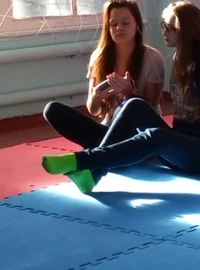 Candid College Girls in Socks and Workout Clothes Sitting on the Floor of the Gymnasium Creepshots