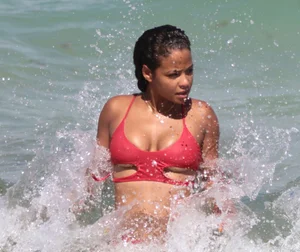 Christina Milian in red bikini in Miami with hard nipples