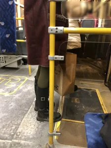 Cute candid winter girl in a public bus, closeups of her slim legs in green pantyhose and boots