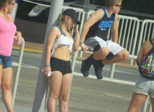 Couple of babes standing around in shorts